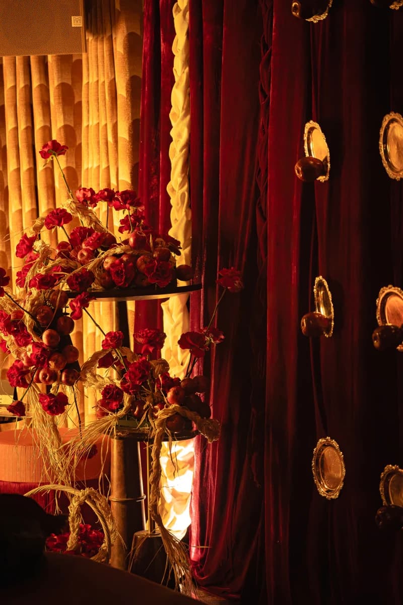 Red velvet magic mirror installation with red roses and fresh apples at Medusa BGC