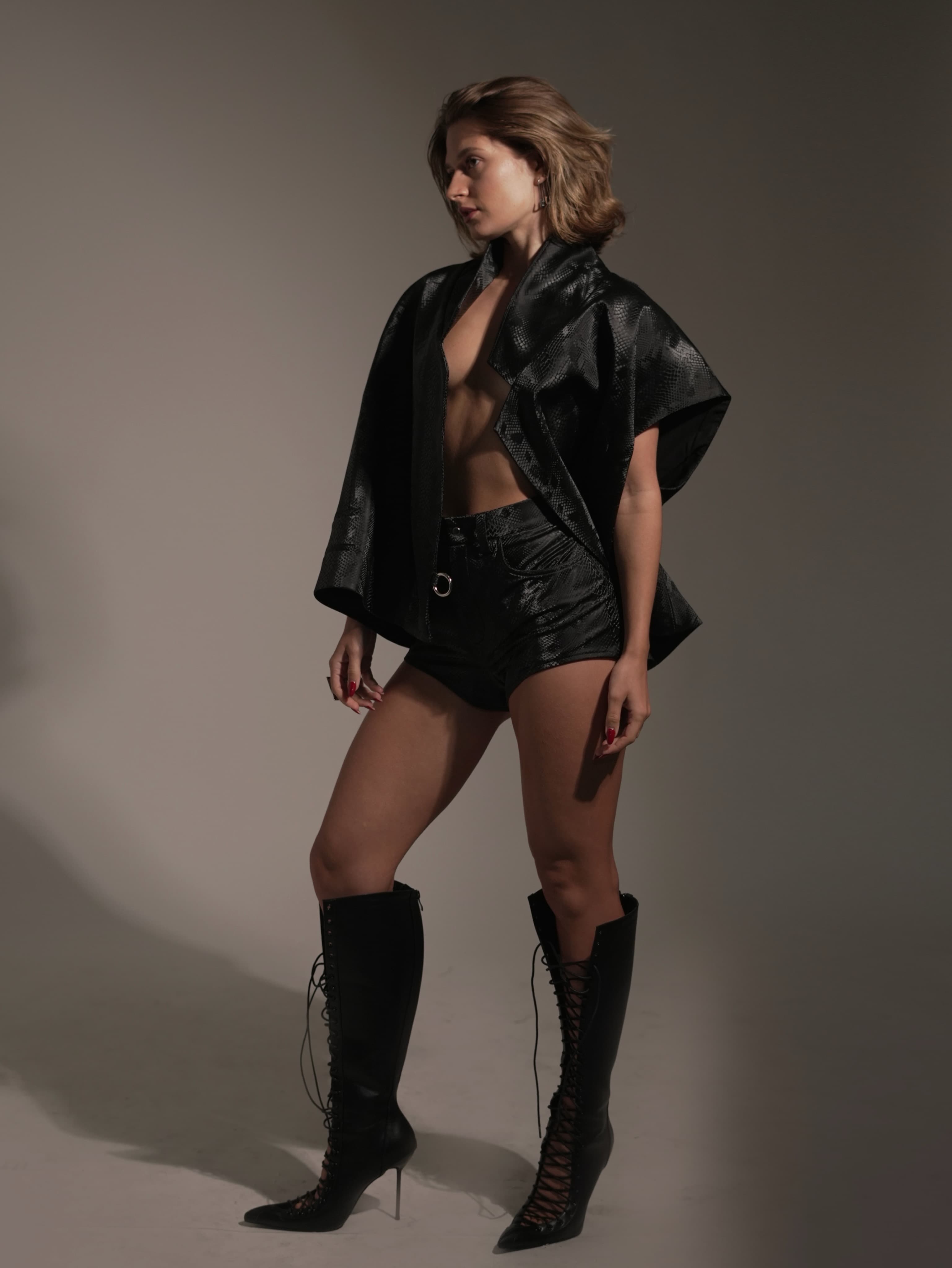 Full-length fashion portrait of Masha in a black Lyssai Limited look