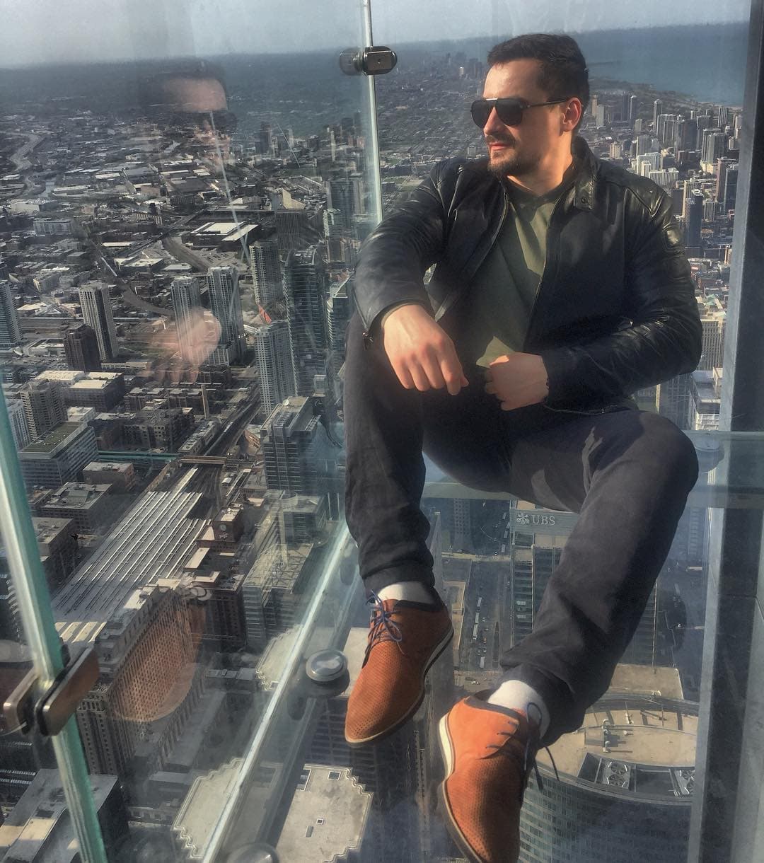 Sergei Normanskii, Co-founder and COO of Holy Chic Flowers, overlooking the Chicago skyline