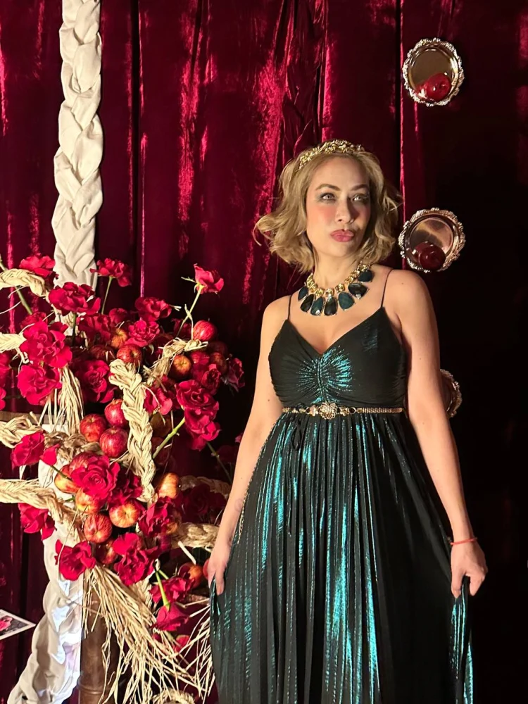 Guest at the Holy Chic fairytale photo area Guest posing beside the red rose apple and mirror photo installation at Medusa BGC