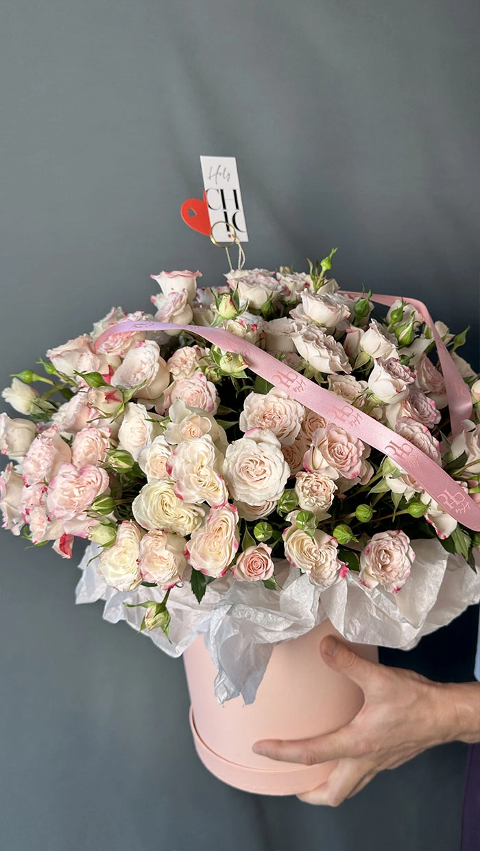 A lush, delicate box filled with an assortment of spray roses