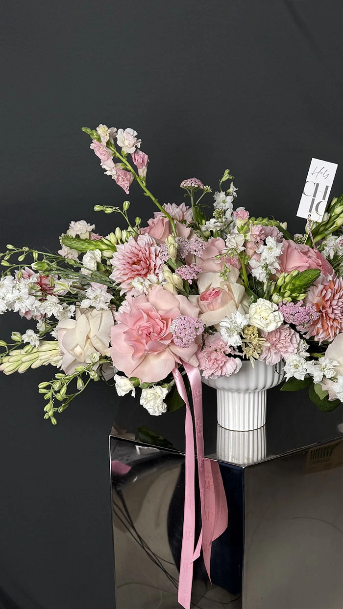 A table arrangement in a vase made of garden flowers